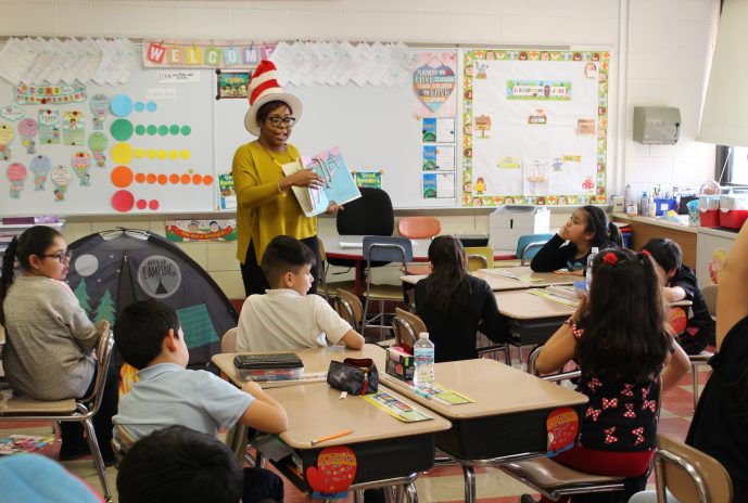 Literacy Coordinator Brandy Bolden reading to students